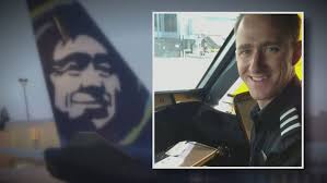 Off-duty pilot said 'I'm not OK' before trying to cut engines midflight,  charging documents say