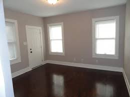 Pin By Danielle Loffler On New Home Items Wishlist Dark Wooden Floor Grey Wall Color Grey And Brown Living Room