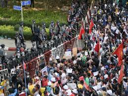 Police in myanmar have responded with increasing violence to protests against last week's military coup, using water cannons, rubber bullets and live ammunition in a crackdown that left a woman in a critical condition on tuesday. Myanmar Military Coup Curfew Imposed In 30 Cities Protests Continue