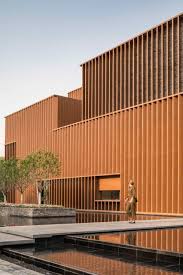 angled aluminium louvres cover the reclaimed brick walls of the junshan cultural center near beijing china desig in 2020 architecture neri and hu modern architecture angled aluminium louvres cover the