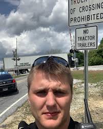 Officer Cole Patterson is not amused. For the second time today a semi is  stuck
