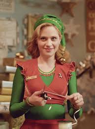 Seasonal Jobs To Help You Make Bank This Holiday Season Christmas Movie Characters Zooey Deschanel Elf Holiday Movie