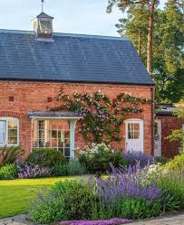 Morton Hall Gardens On Instagram The Royal Wall Rosa Clarence House And Clematis Prince Charles On The Coachhouse In 2020 Clematis Clarence House Architecture