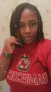 Who is a mobile barber in St George?