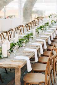 Simple Wedding Reception Decor Idea Long Wooden Tables With Greenery Garland Outdoor Wedding Reception Decorations Outdoor Wedding Tables Farm Table Wedding