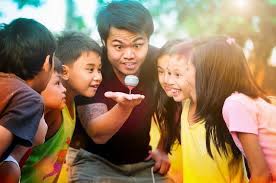 Trumpo Is A Filipino Game Where Players Aim To Have Their Top Spin The Longest Filipino Culture Relaxing Songs Traditional Filipino Games