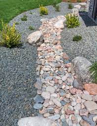 Gravel beds help to prevent overgrown weeds. Dry Stream Beds For Drainage How To Build A Dry Creek Bed In The Landscape