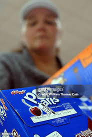 Amelia's Grocery Outlet employee Dale Groff stocks a freezer at the... News  Photo
