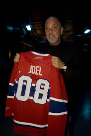 When carrier's montreal canadiens hockey sweater wears out, his mother writes to eaton's to order a new one. Le Chanteur Billy Joel Tenant Un Chandail Du Canadien De Montreal Well Known Singer Billy Joel Holding A Montreal Canadien Jersey Billy Joel Piano Man Singer