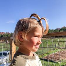 Have I mentioned we now own a rhinoceros? Ewan spent the day as a rhino,  complete with rhino horns. His hair is in that really awkward grow-out  phase, so I'm happy with