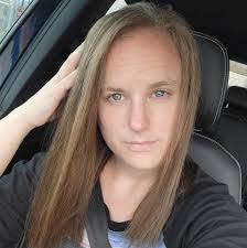 What is the process and cost of making a custom quilt from baby clothes?