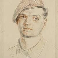 Engineman 1st Class Brandon Lovell is fitted for a combination cover by his  wife after being announced the 2017 Navy Reserve Sailor of the Year during  a ceremony at the U.S. Navy