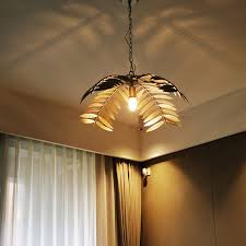 Six palm leaves project a moody light through their leaf detail. Creative Iron Palm Leaf Pendant Lamp Hotel Homestay Restaurant Living Dining Bedroom American Country Style Metal Hanging Light Pendant Lights Aliexpress