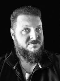 Should I caulk between the J channel and windows during siding installation?