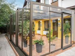A more lightweight, retractable enclosure that keeps the space open most of the time, but that can be closed when the weather demands it. Luxurious Innovative Conservatory Patio Enclosure Corso Glass Photogallery Alukov Co Uk