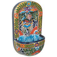 Flowing water is the backdrop of history. Talavera Wall Fountain With Frog