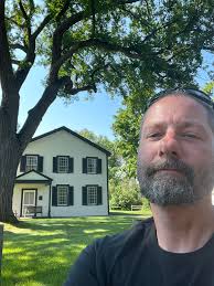 Rustic Road 69 sign missing, old agency house photo