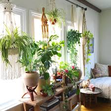 The home functions as a living and working space, so instead of carving out an office the computer is worked into the decor on the left. Unique And Creative Hanging Plant Decoration For Home