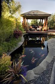 In A Small Yard The Pond Grew To Fit The Koi Garden Pond Design Backyard Gazebo Koi Pond Design
