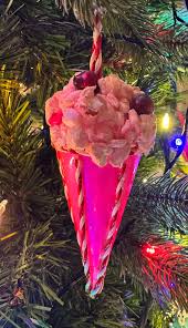 My mother loved flocked Christmas trees and often color coordinated her  ornaments to the pastel flocking. This is the only surving one of a set of  six pink cone style ornaments she