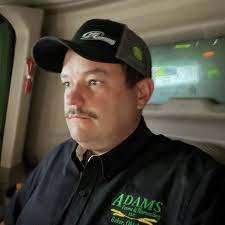 Hi We have a 936D front direct heading canola, the middle belt keeps  building up between the middle of the belts and jamming