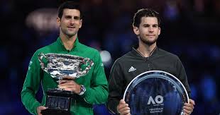 Novak djokovic battled through intense pressure from dominic thiem to reassert his dominance at the australian open on sunday, claiming a record eighth title and in doing so retaking the world number one ranking. Novak Djokovic Beats Dominic Thiem In Five Setter To Win 8th Australian Open And 17th Grand