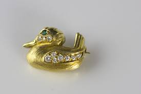 Almost everyone has a duck tape story to tell, usually praising its remarkable strength and versatility. 18k Yellow Gold Duck Pin With Green Eyes Diamond Accents James Mchone Jewelry