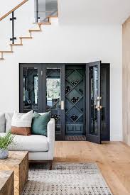 Our classic full glass wine cellar door with two custom sidelights. Wine Cellar Under Staircase Transitional Living Room