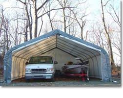 The car is parked next to a wall. Patio Store Mdm Rhino Shelters 22 X 24 X 12 House Style Instant Garage