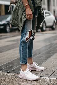 Woman Wearing Nike React Running Shoe Ripped Denim Jeans Green Utility Jacket Fashion Jackson Dallas Blogger F Running Shoes Outfits Denim Jeans Ripped Fashion