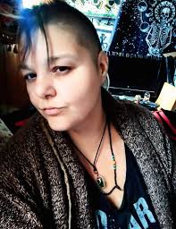 Yolo ethnic ladies in field of buckwheat flowers.