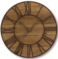 Clock on wall shows eight oclock. Millwood Pines Oversized Langan Roman Numeral Wall Clock Reviews Wayfair