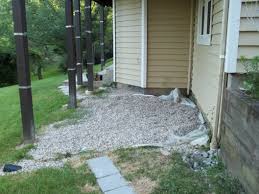 Edging can be as cheap as the black plastic you find at hardware stores or blocks of granite found at the the former will always slip under car wheels or feet because its edges will slip off one another. Did I Do The Right Thing Putting Small Stones Under My Deck Home Improvement Stack Exchange