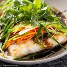 A Steamed Fish Fillet With Soy Sauce Ginger Scallion Onion And Carrot In 2020 Steamed Fish Steamed Fish Recipes Indian Rice Recipes