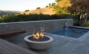 Always position a fire pit away from any flammable objects. 15 Dramatic Modern Pool Areas With Fire Pits Home Design Lover