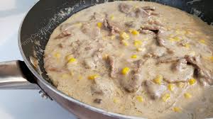 Brown 1 lb of ground beef, drain off fat then add a chopped onion and minced garlic (2 or 3 cloves), salt and pepper and cook for about 5 minutes. Beef In Corn And Cream Of Mushroom
