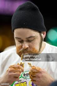 Molly Schuyler eats wings during Wing Bowl 23