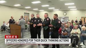 Brook Park police officers, fire chief honored after saving woman from  burning home