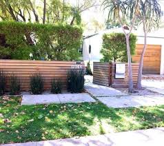 It's such an adorable fence design. Top 60 Best Front Yard Fence Ideas Outdoor Barrier Designs Modern Front Yard Modern Fence Design Fence Landscaping