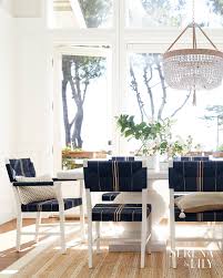 We Are In Love With This Sophisticated Dining Room With Its Navy Blue Natural Fiber Chairs Beaded Chande Side Chairs Dining Swivel Dining Chairs Dining Chairs