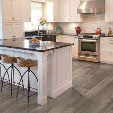 Laminate white kitchen flooring ideas options. Pergo Portfolio Wetprotect Waterproof Aged Silver Mist 7 48 In W X 54 33 In L Waterproof Embossed Wood Plank Laminate Flooring 19 76 Sq Ft Lowes Com In 2021 Grey Laminate Flooring Kitchen Laminate Flooring In