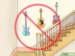 Simple and stylish way to display your guitar. How To Hang Instruments On The Wall 15 Steps With Pictures