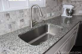 A host of magnificent monuments around the world stands as testimony of the beauty of granite stones. At Home With Baby Gizmo Episode Four The Kitchen Baby Gizmo Company White Kitchen Remodeling Granite Kitchen Counters Granite Kitchen