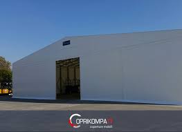 Pvc da 750 gr/mq i teli pvc che ricoprono i nostri tunnel sono i più robusti sul mercato, con un peso di 750 gr/mq! Coperture Capannoni Agricoli Capannoni Mobili Coprikompatt