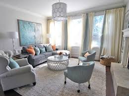 Transitional dark wood floor, brown floor, coffered ceiling, wainscoting and wallpaper dining room photo in los angeles with gray walls. Effective Gray Living Room Ideas Decorifusta