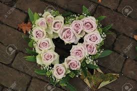 Maybe you would like to learn more about one of these? Heart Shaped Purple Sympathy Flowers Or Funeral Flowers Near A Tree Stock Photo Picture And Royalty Free Image Image 82104831