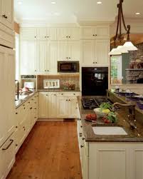 In the photo, this homeowner chose to go with white cabinets as well, which adds a warm vibe to whole kitchen. Tropical Brown Granite White Cabinets Ideas Photos Houzz
