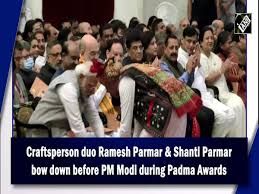 Craftsperson duo Ramesh Parmar & Shanti Parmar bow down before PM Modi  during Padma Awards
