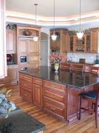 Pioneer Cabinetry Melbourne Door Style In Both Maple And Cherry Wood Kitchen Design Cabinetry Cabinet Design