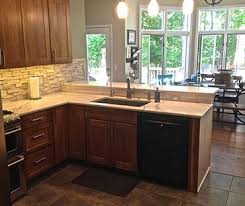 Fully equipped kitchens with quartz stone countertops, stainless steel appliances, custom cabinets and tile backsplashes. Carpeting And Flooring Saline Build Green Today Ann Arbor
